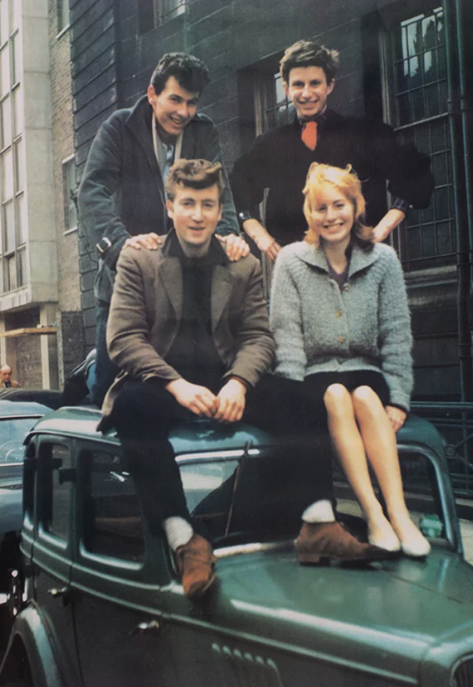 john and cynthia lennon sitting on car